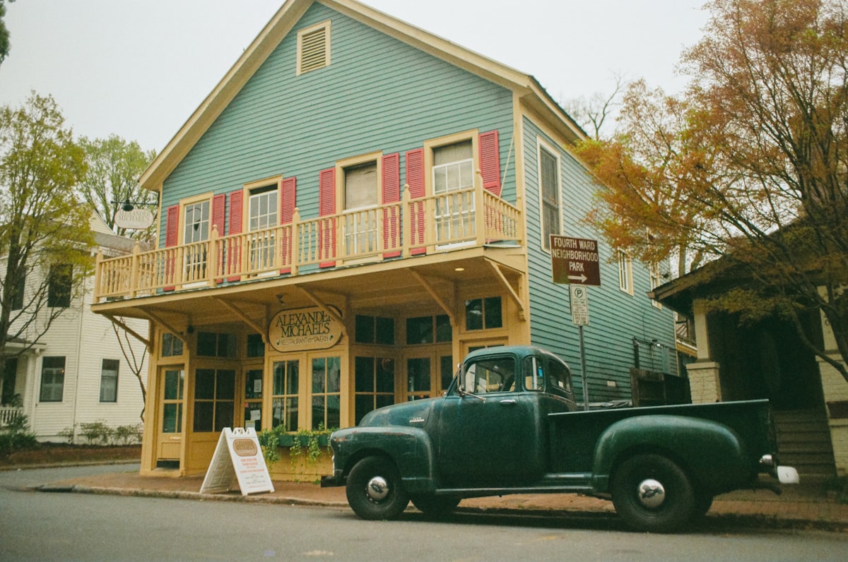 black crew cab pickup truck parked beside pink and white house related to Bed and Breakfast in Alexandria, VA: Unforgettable Accommodations