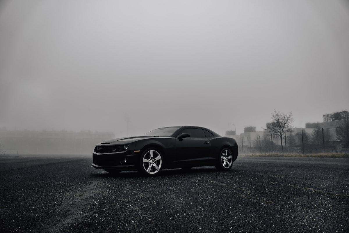 black Dodge Challenger on road during foggy day related to Taking Your 2010 Camaro to the Next Level: The Rear Valance Upgrade