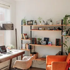 black laptop computer on brown wooden table related to Enhancing Your Space