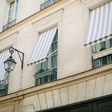 black sconce lamp on white concrete building related to Toile Window Valances