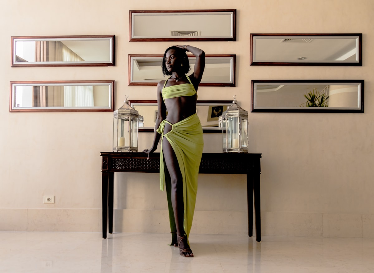 Black woman in a green dress related to Elegant Decor: The Beauty of Black Lace Valance