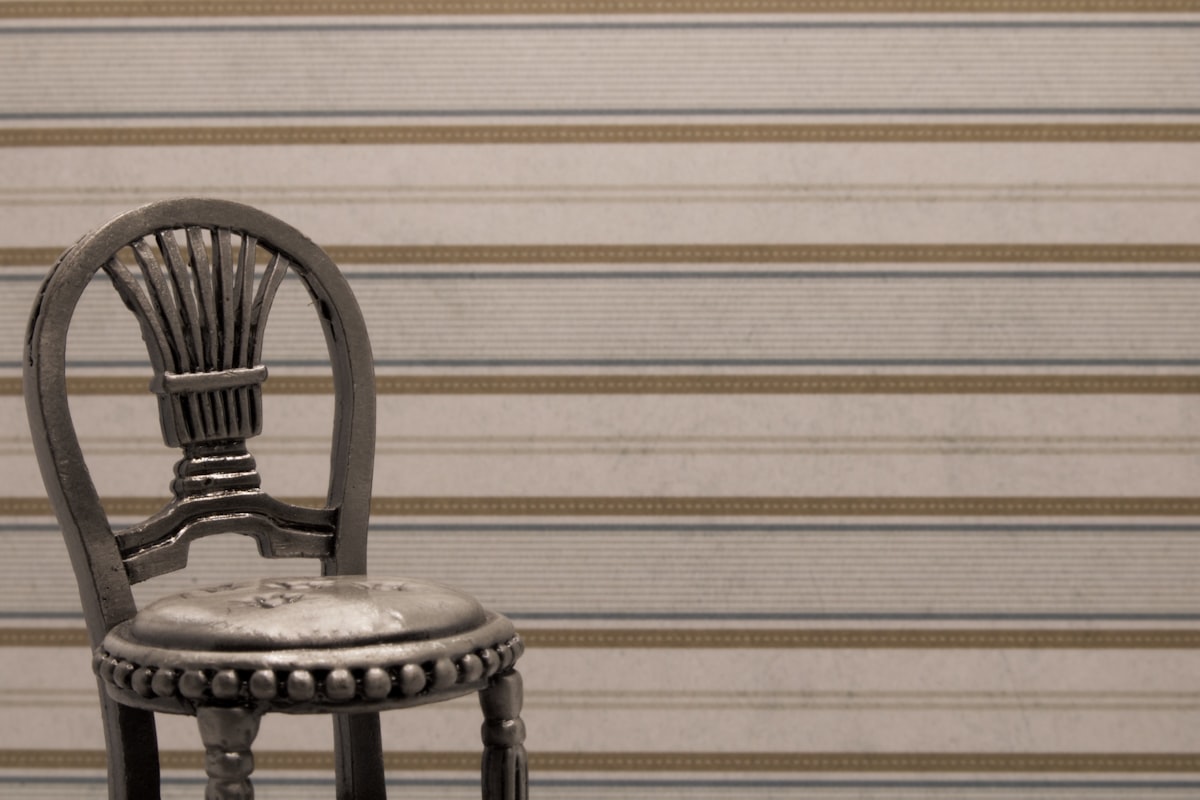 black wooden chair beside white wall related to Adding a Touch of Elegance with Ticking Stripe Valance