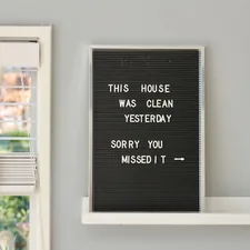 black wooden signage on white wooden floating shelf related to Elevate Your Windows with These Valance Designs