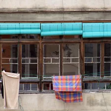 blue and red towel hanging near window related to Turquoise Valance Curtains