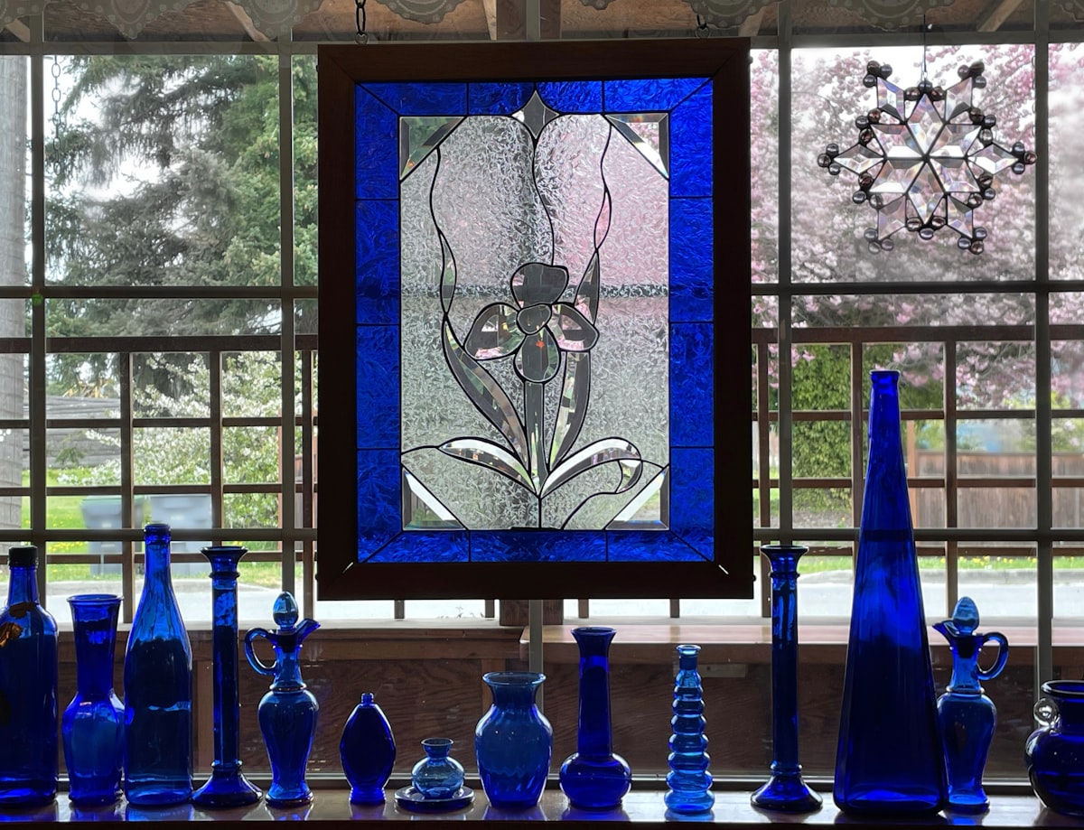 blue and white glass bottles related to Mastering the Art of Window Decor: A Guide to Hunter Douglas Valance Clips