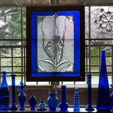blue and white glass bottles related to Mastering the Art of Window Decor: A Guide to Hunter Douglas Valance Clips