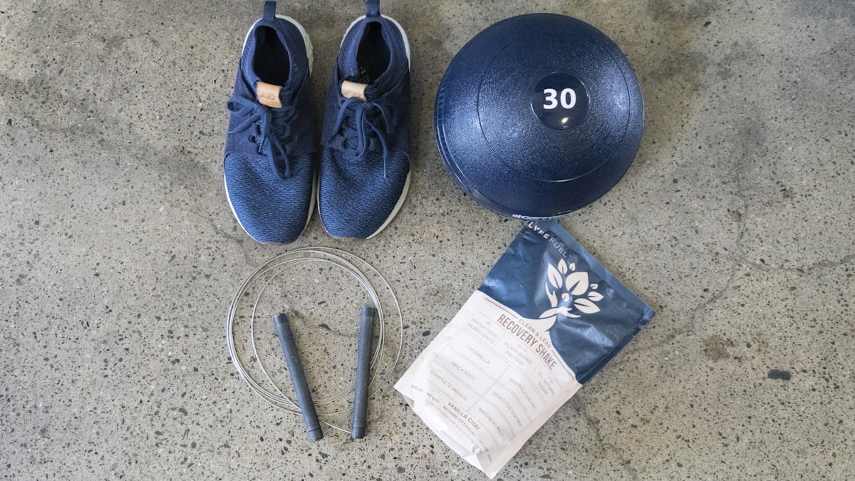 blue and white nike athletic shoes beside black round exercise ball related to Essential Components for a Functional Bed