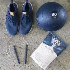 blue and white nike athletic shoes beside black round exercise ball related to Essential Components for a Functional Bed