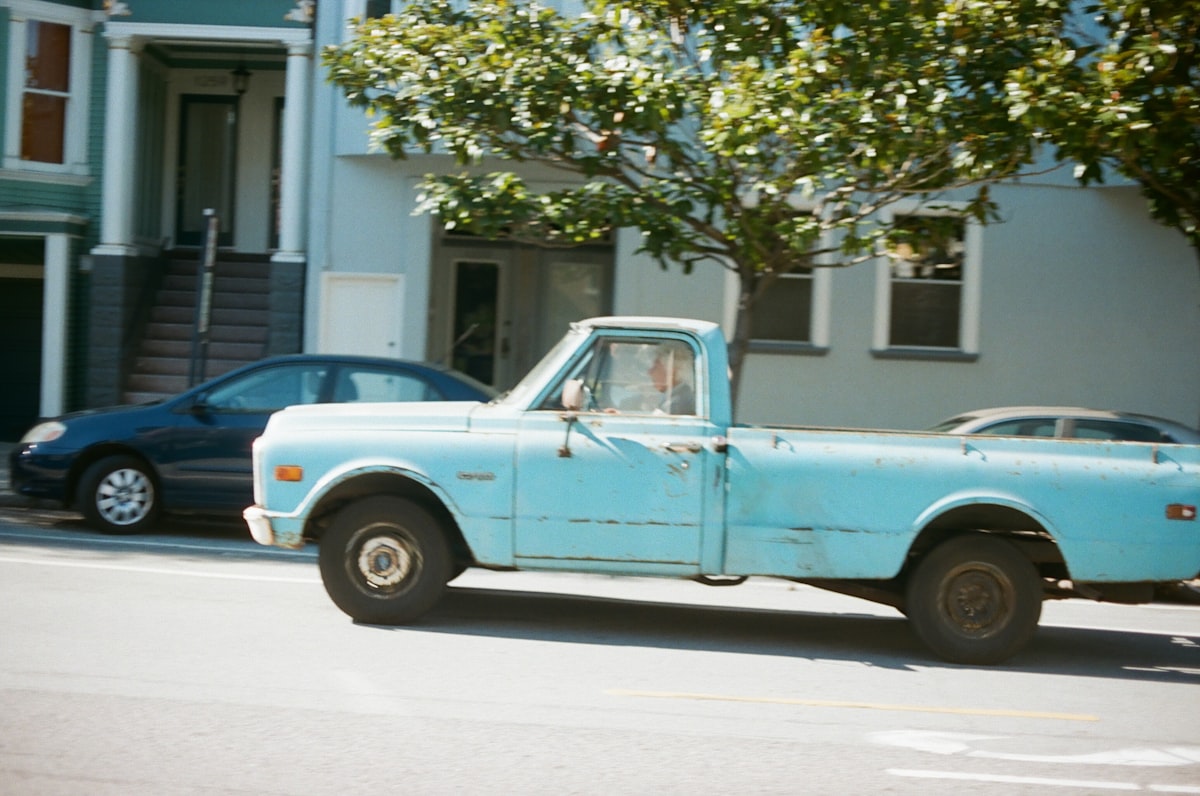 blue and white single cab pickup truck parked near green tree during daytime related to Trick Out Your Pickup with Bak Bed Covers