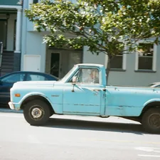 blue and white single cab pickup truck parked near green tree during daytime related to Trick Out Your Pickup with Bak Bed Covers