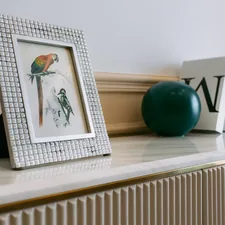 blue ball on white wooden shelf related to Adding Storage and Elegance: Sideboard with Wine Rack