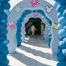 Blue balloon archway decorated with mickey mouse theme related to Dreaming of Disney: The Ultimate Guide to Minnie Mouse Bed