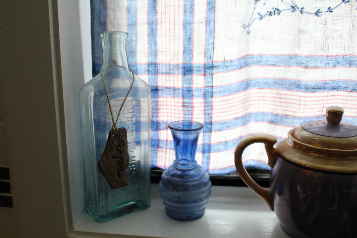 blue bottles in windowsill related to Plaid Kitchen Curtains Valances