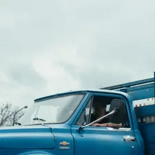 blue car on snow covered ground related to The Ultimate Guide to Truck Crib Bedding for Your Little One