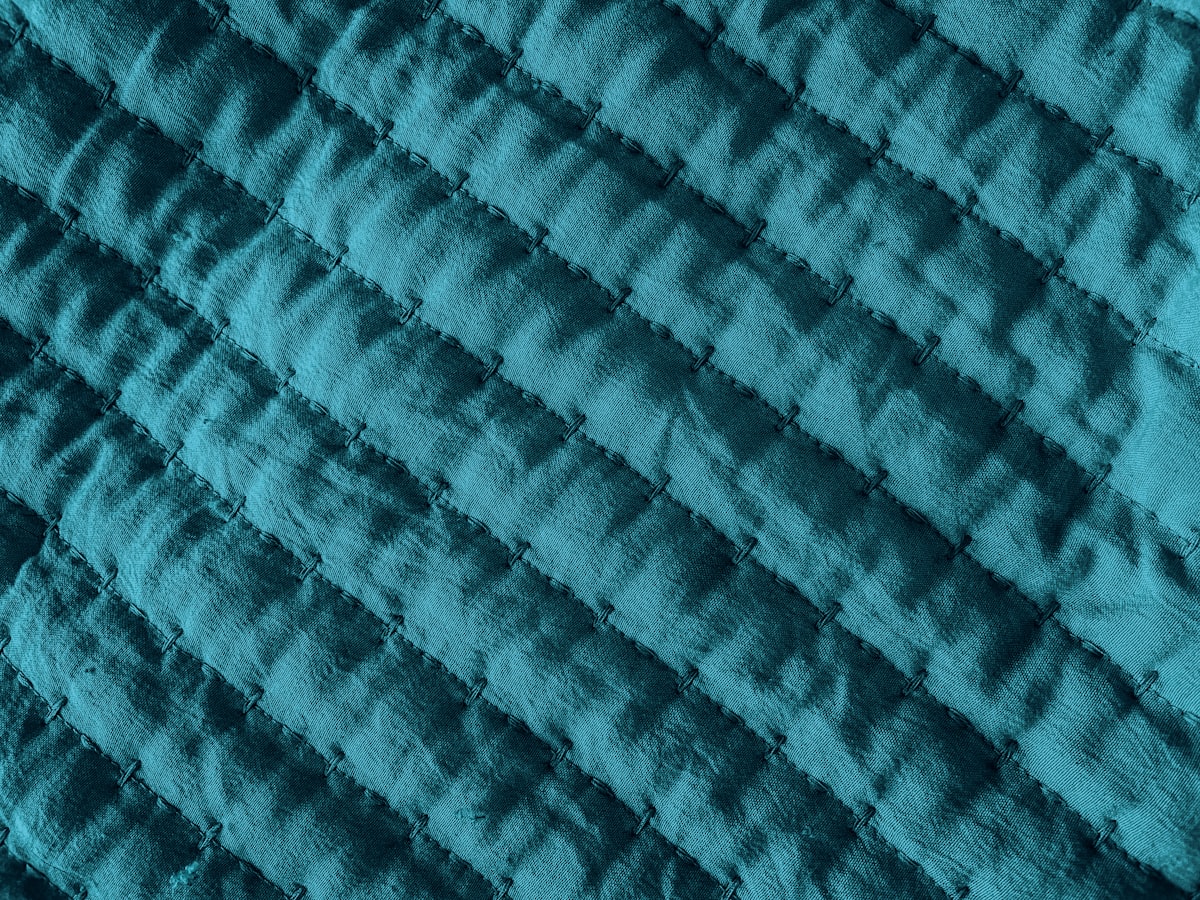 Blue Fabric Textured Material related to The Ultimate Guide to Coverlets King Size