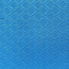 blue textile in close up photography related to Turquoise Quilted Coverlet: Elegant Bedding for Any Room