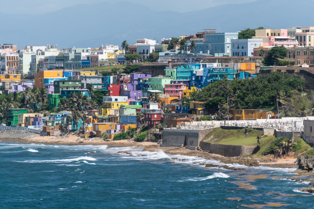 body of water near concrete buildings at daytime related to Exploring the Charm of Puerto Morelos Bed and Breakfasts: Your Guide to a Cozy Coastal Escape