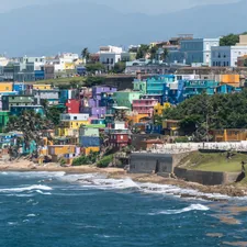 body of water near concrete buildings at daytime related to Exploring the Charm of Puerto Morelos Bed and Breakfasts: Your Guide to a Cozy Coastal Escape