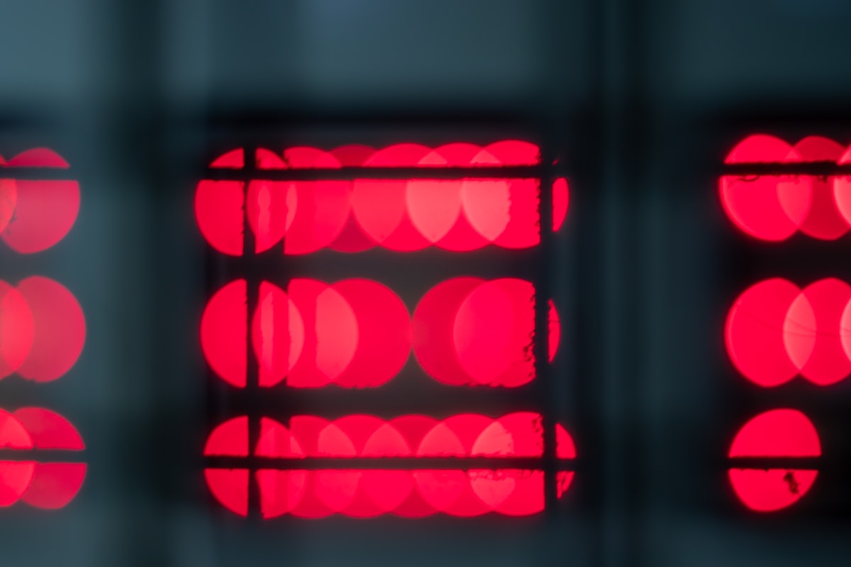 bokeh photography of red lights related to Unlock the Power of Red Light Therapy with a Bed for Total Wellbeing
