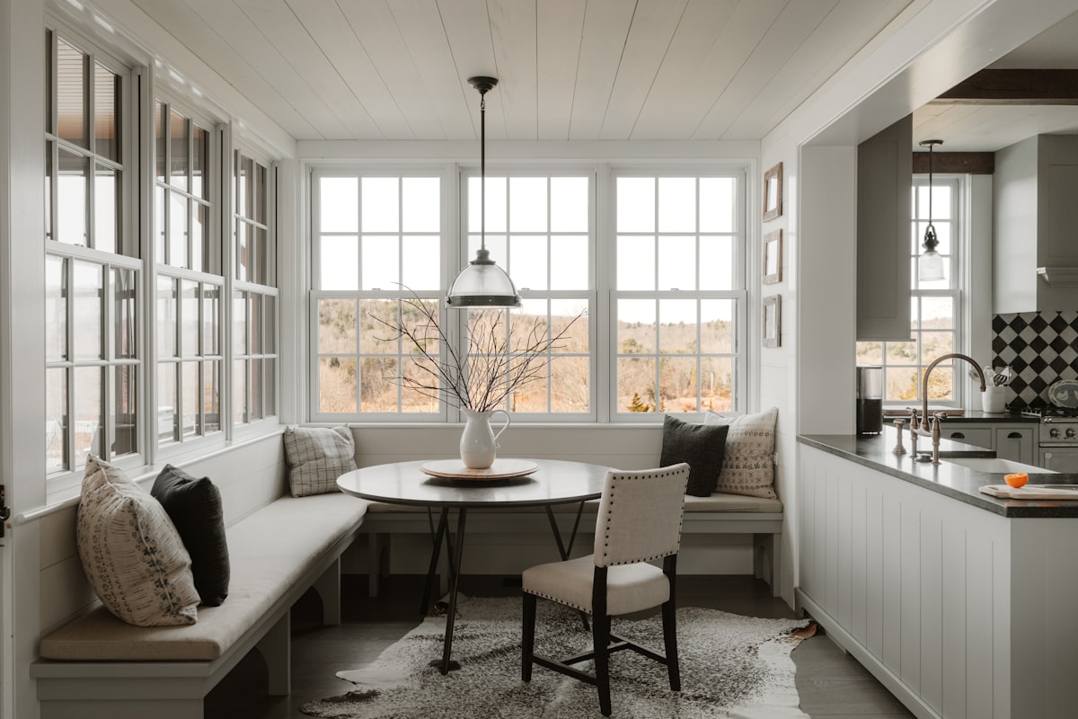 Breakfast nook (IG: @clay.banks) related to Elevate Your Dining Space with Stunning Dining Room Window Valances