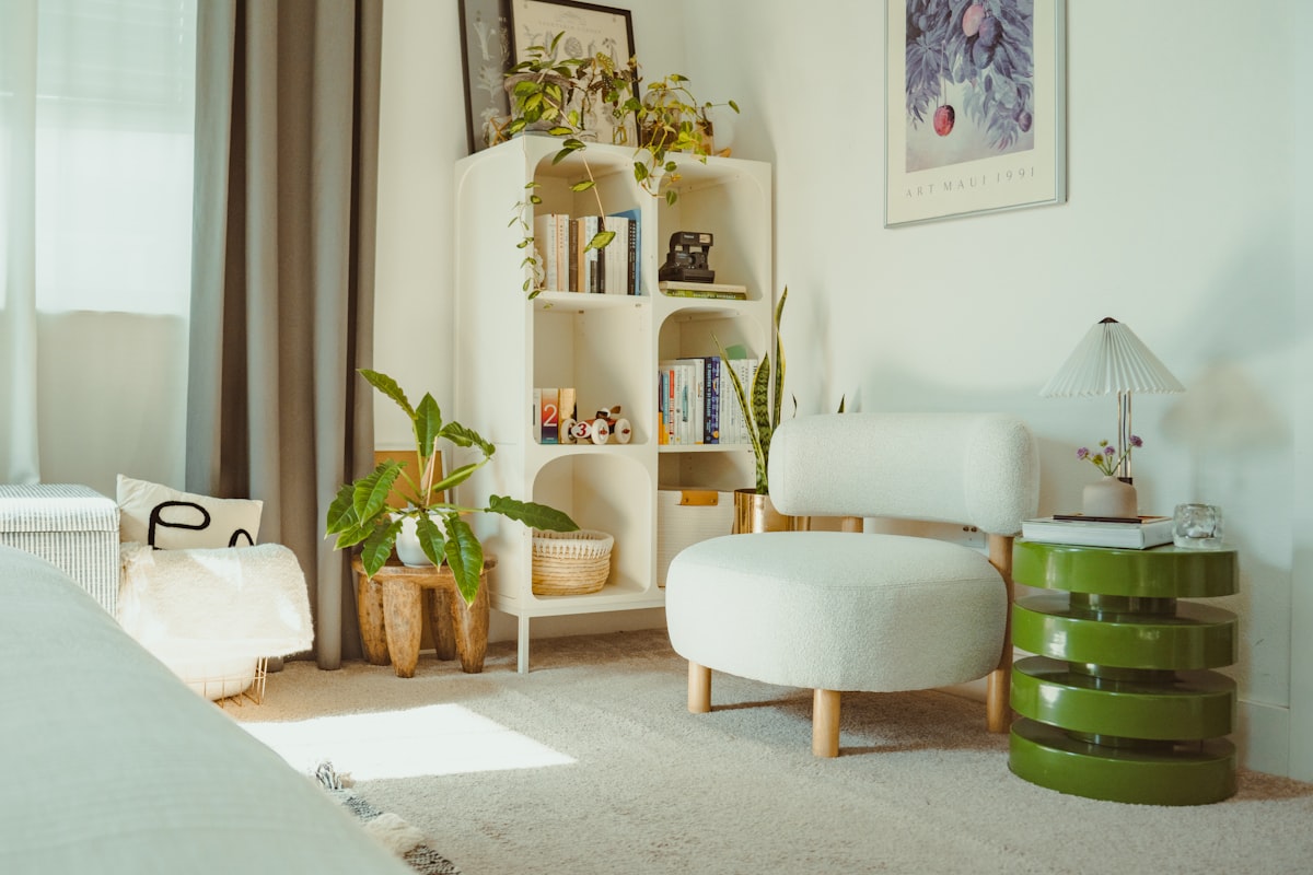 Bright, cozy room with plants and a white chair. related to Transform Your Space with Bedroom Curtains and Valances