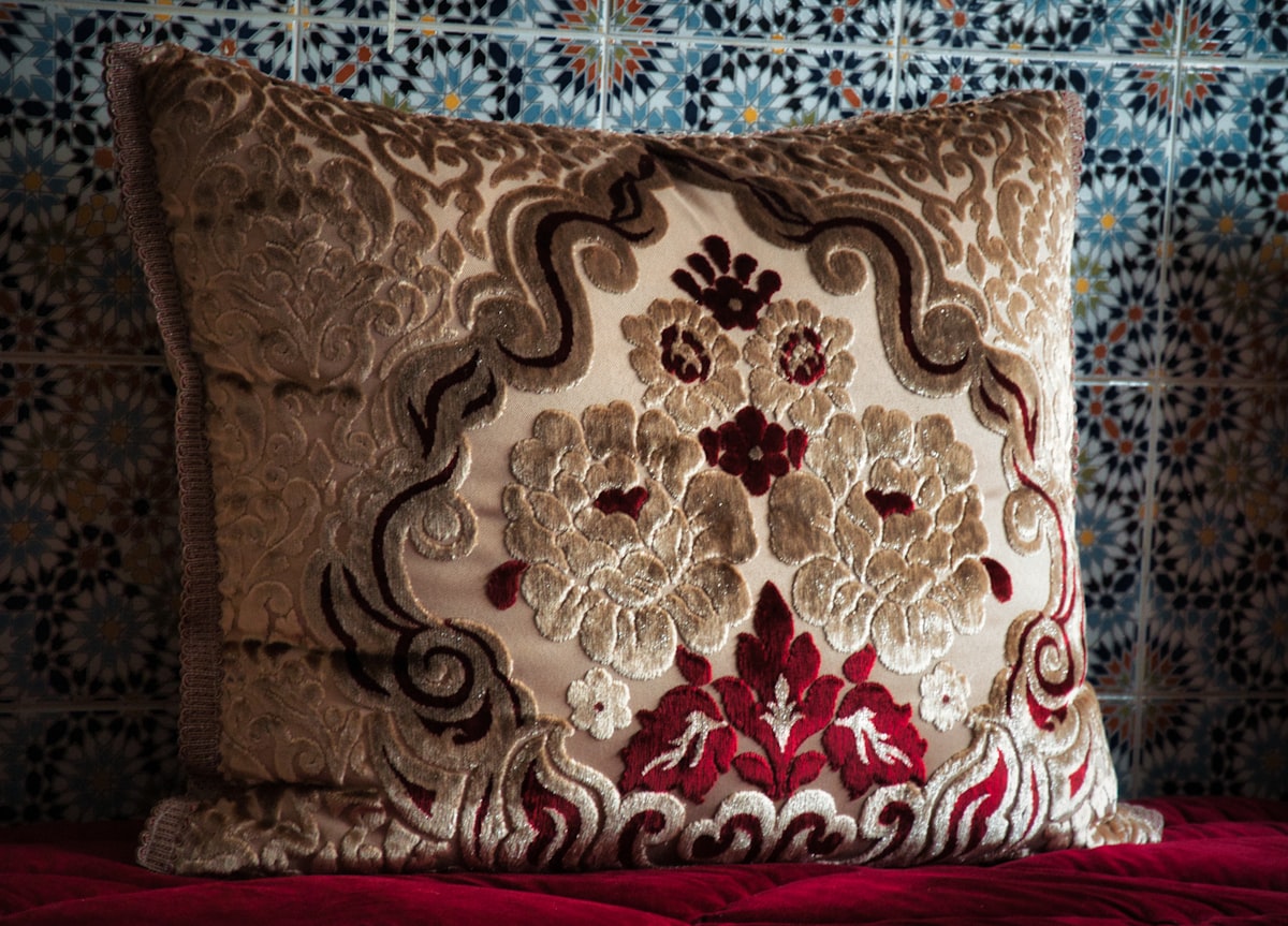 brown and white floral throw pillow related to Transform Your Bedroom with Moroccan Style Bedding