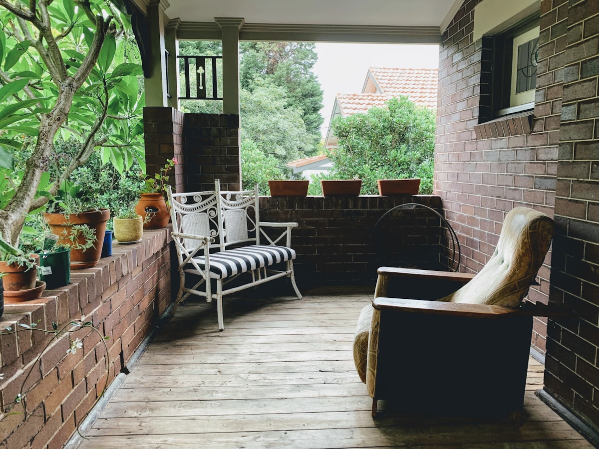 brown and white wicker armchairs related to Outdoor Porch Valances: Elevate Your Exterior Decor