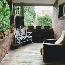 brown and white wicker armchairs related to Outdoor Porch Valances: Elevate Your Exterior Decor