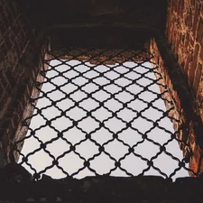 brown brick wall with black metal frame related to The Ultimate Guide to Choosing the Perfect Rugs Under Beds