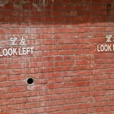 brown brick wall with no smoking sign related to The Dark Truth Beneath