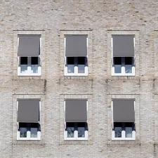 brown concrete building with glass windows related to Modern Window Valance Ideas
