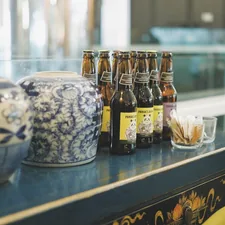 brown glass bottles related to The Modern Asian Touch: Unveiling the Allure of Chinese Sideboard Buffets