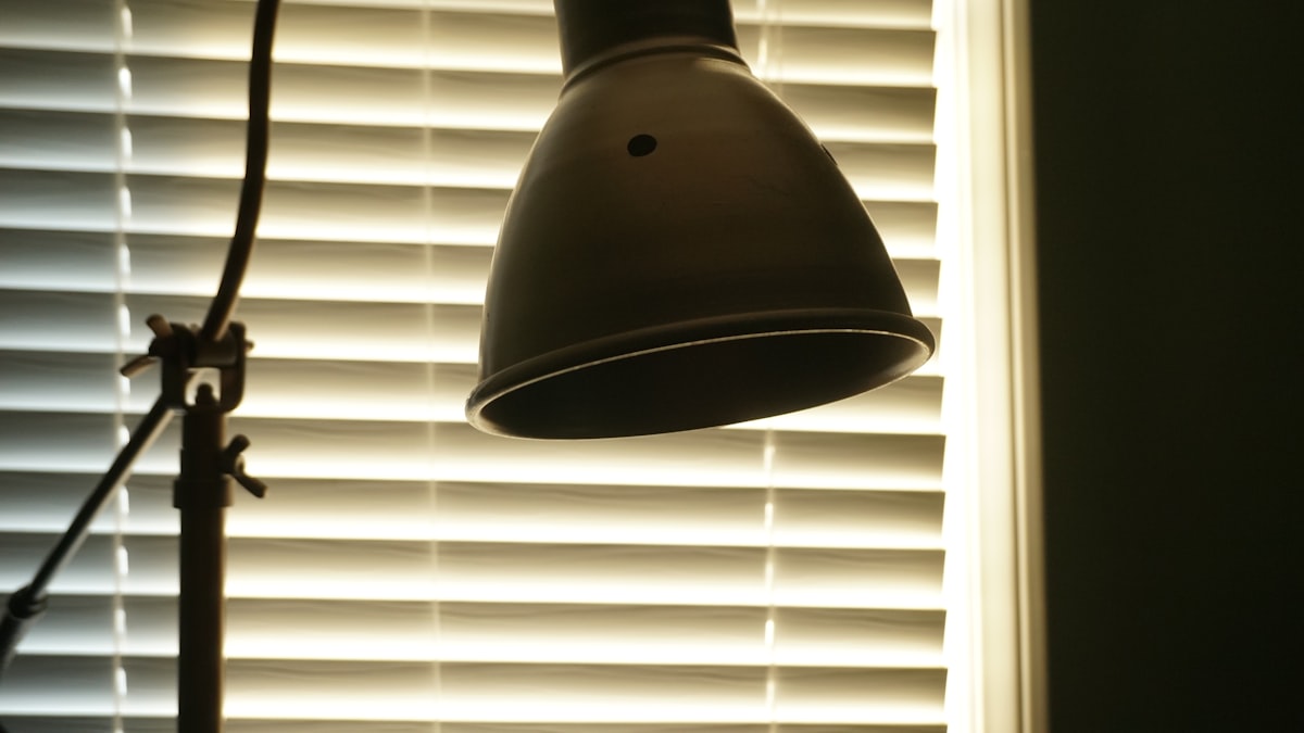 brown lamp related to Elevate Your Window with a Light Blue Valance