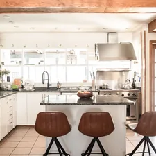 brown wooden bar stools beside kitchen counter related to Elevate Your Kitchen Style with Modern Kitchen Valances