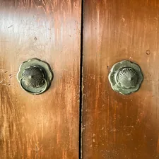 brown wooden door with silver door knob related to The Timeless Elegance of Antique Buffet Sideboards