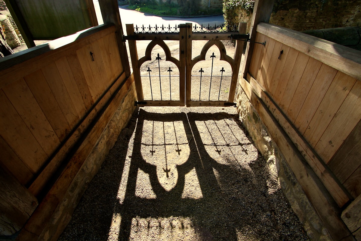 brown wooden fence near green grass field during daytime related to Unlock the Magic: Castle Bunk Bed Essentials