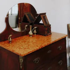 brown wooden framed mirror on brown wooden drawer related to Elegant Additions to Your Home: Antique Sideboards with Marble Tops