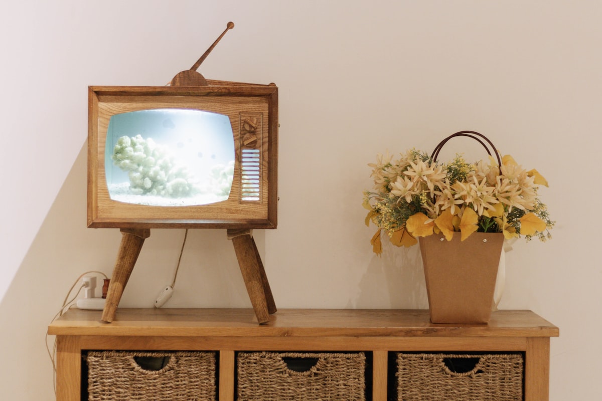 brown wooden framed picture frame on brown wooden table related to Elevate Your Home Theater Experience with TV Sideboards Furniture