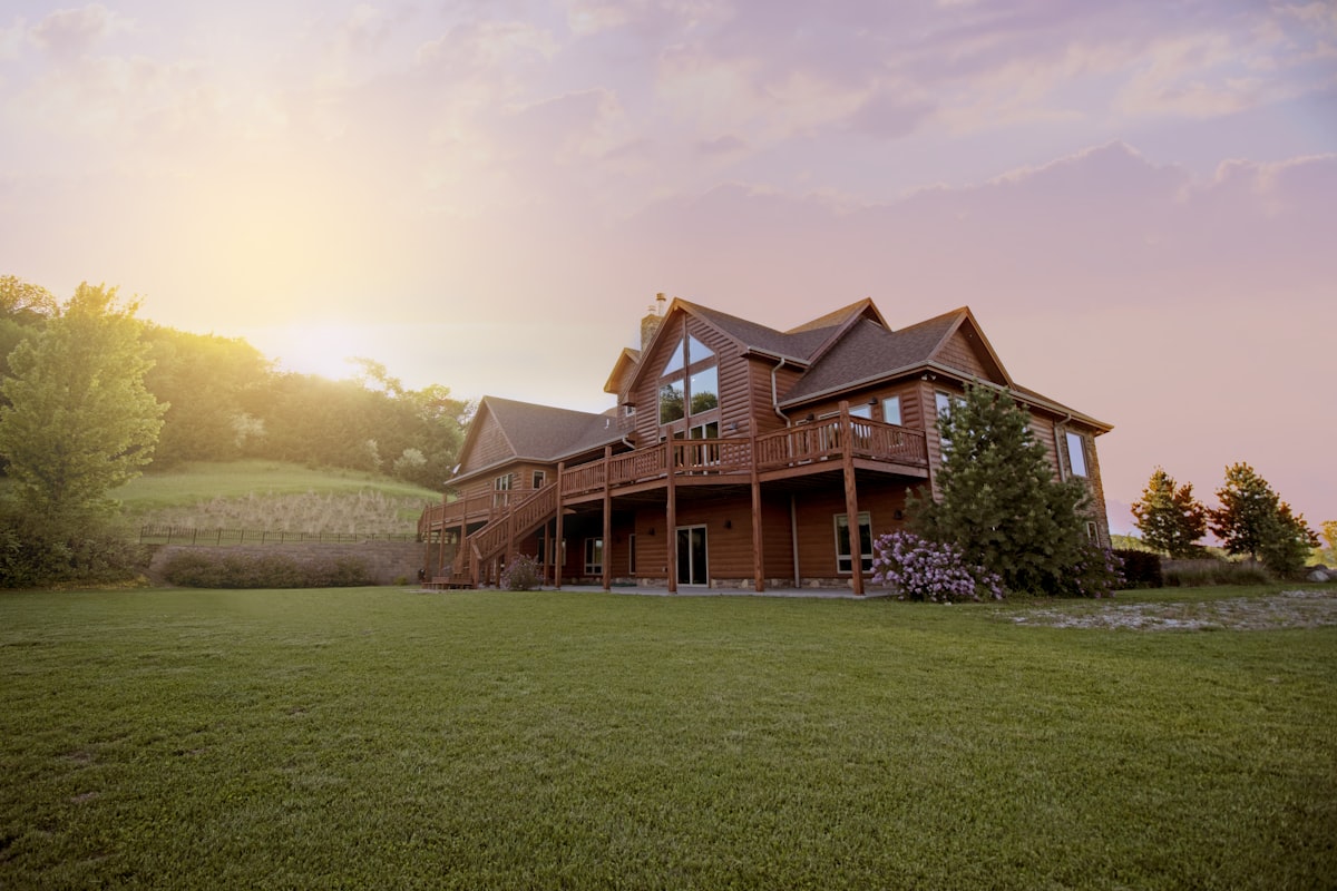 brown wooden house with green grass field related to Transforming Your Dream Home with Bed Bath & Beyond Registry