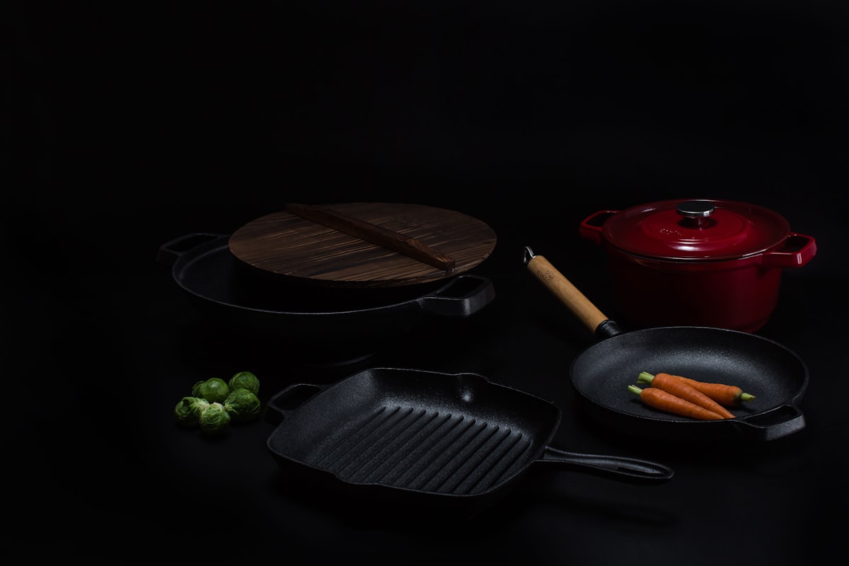 brown wooden round chopping board beside black frying pan related to The Benefits of a Large Cast Iron Chiminea for Your Backyard