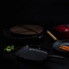 brown wooden round chopping board beside black frying pan related to The Benefits of a Large Cast Iron Chiminea for Your Backyard