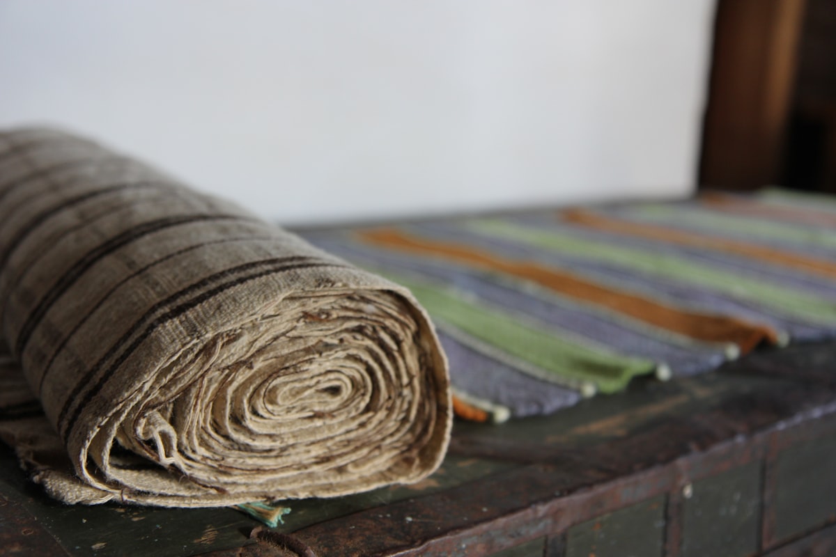brown wooden round ornament on brown wooden table related to Striped Quilts and Coverlets