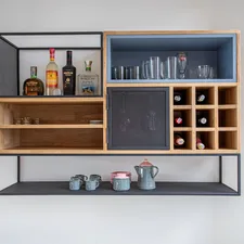 brown wooden shelf with bottles and jars related to Enhance Your Home Bar with a Sleek Sideboard Liquor Cabinet
