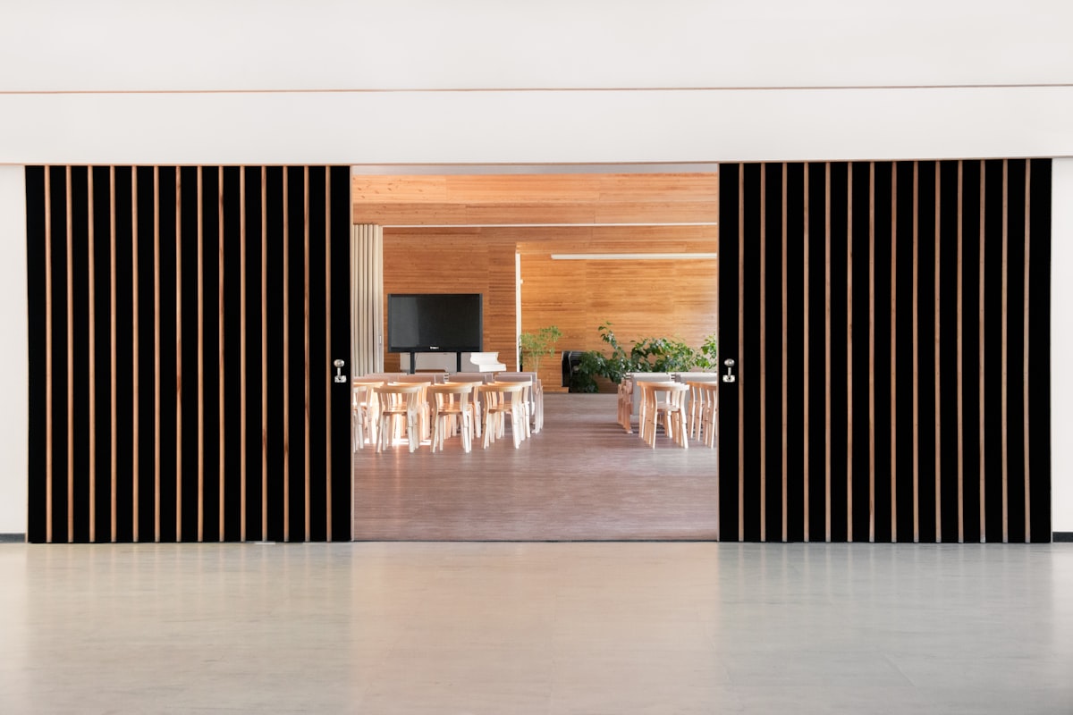 brown wooden table and chairs related to Sliding Door Valance: Elevate Your Room's Style