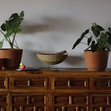 brown woven basket on brown wooden drawer related to Crafting Your Dream Space: A Step-by-Step Guide to Building a Sideboard