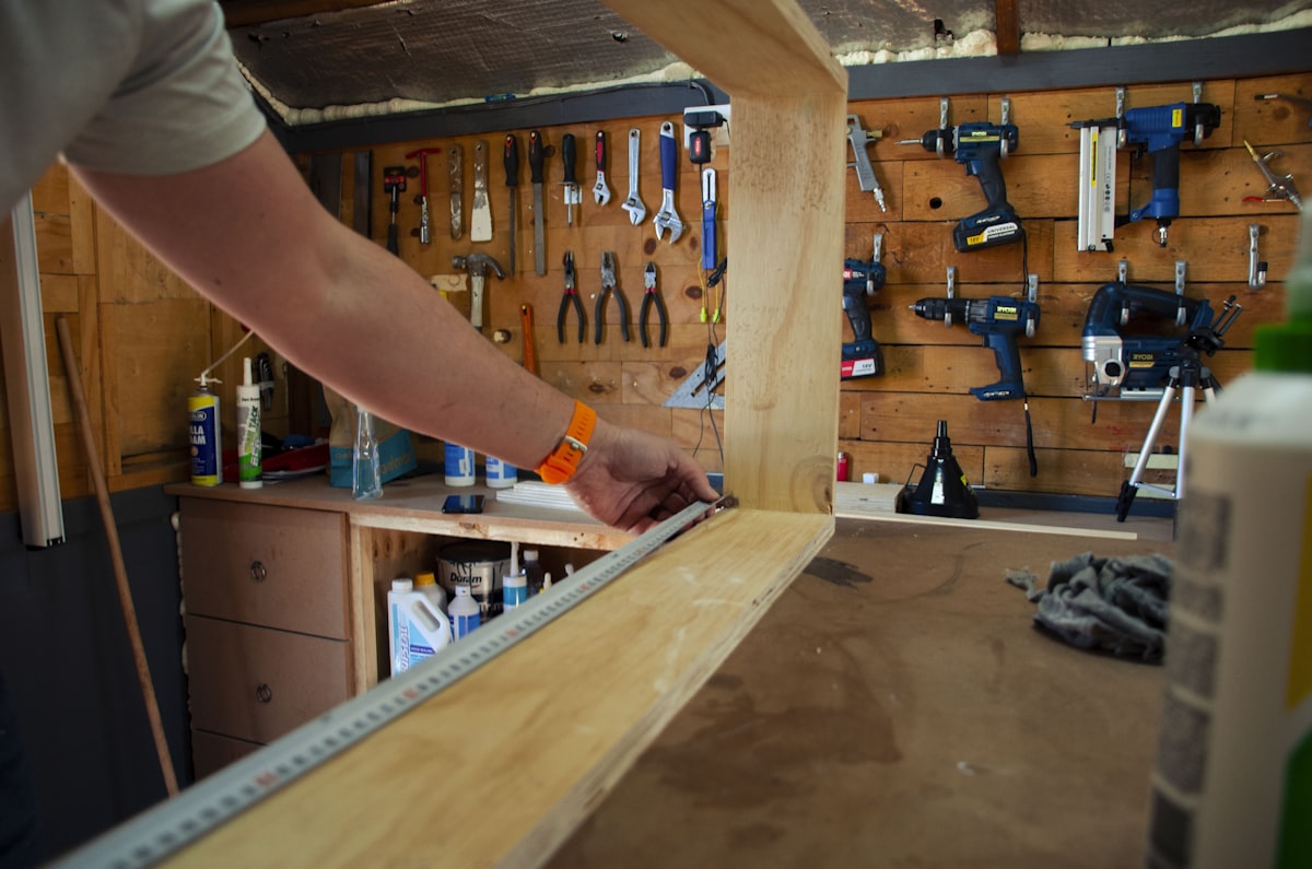 Carpenter in action related to DIY Guide: How to Build a Murphy Bed