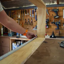 Carpenter in action related to DIY Guide: How to Build a Murphy Bed