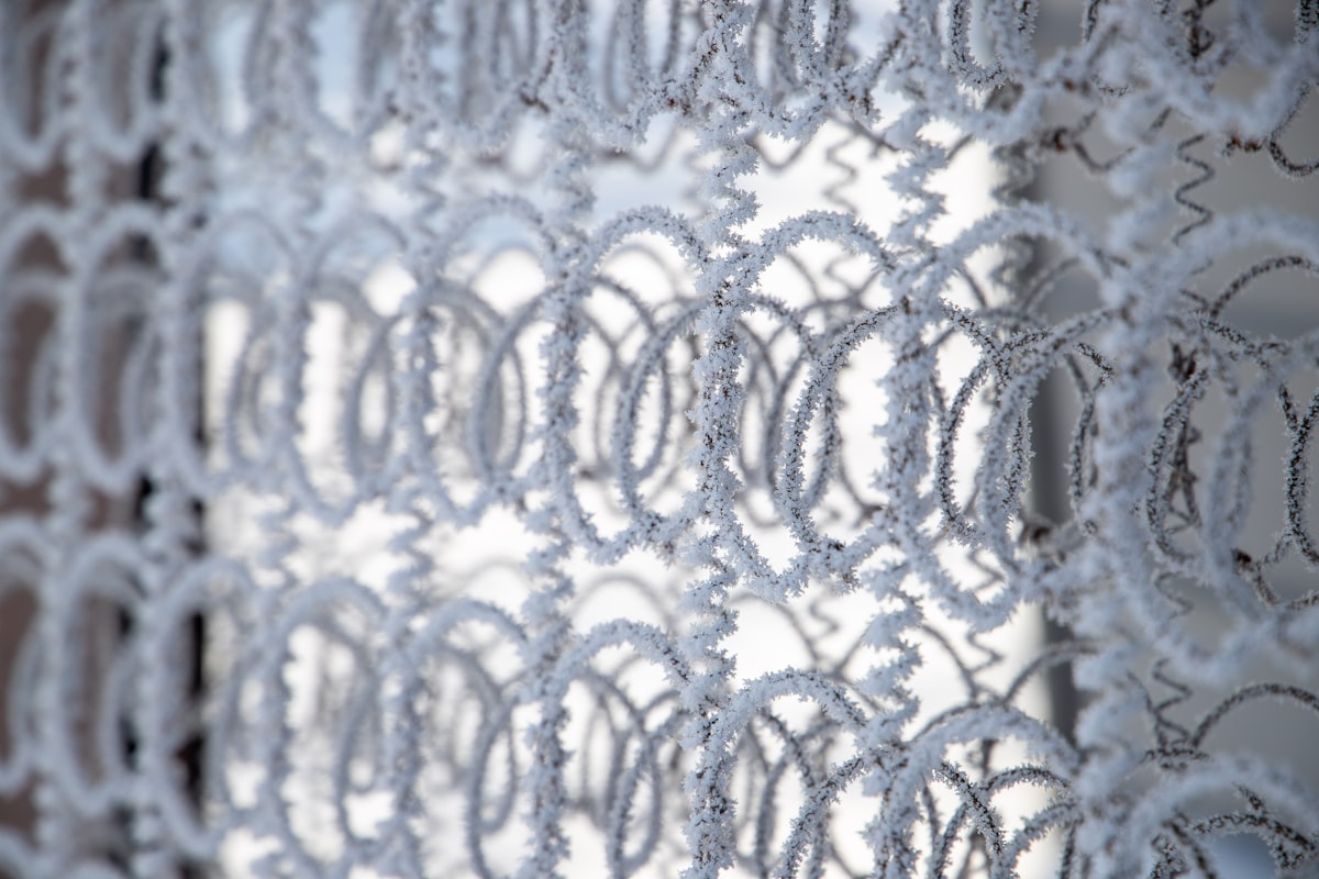 chain link covered by snow related to Crochet Curtain Patterns: Elegance and Functionality for Your Home