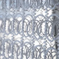 chain link covered by snow related to Crochet Curtain Patterns: Elegance and Functionality for Your Home