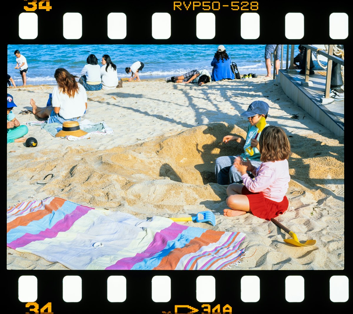 Children playing with sand on a sunny beach. related to Transform Your Sleep Space with Fun Bed Sheets